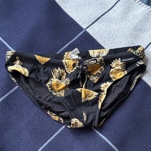 Dolce & Gabbana Black Swim Briefs with Gold Sacred Heart Motif